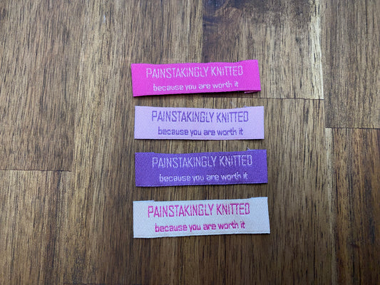 "Painstakingly knitted. Because you are worth it." - Clothing Labels for Knitted Garments - 15 mm height, 60 mm length. Cotton. Pink, purple and beige. (4 pcs / 16 pcs)