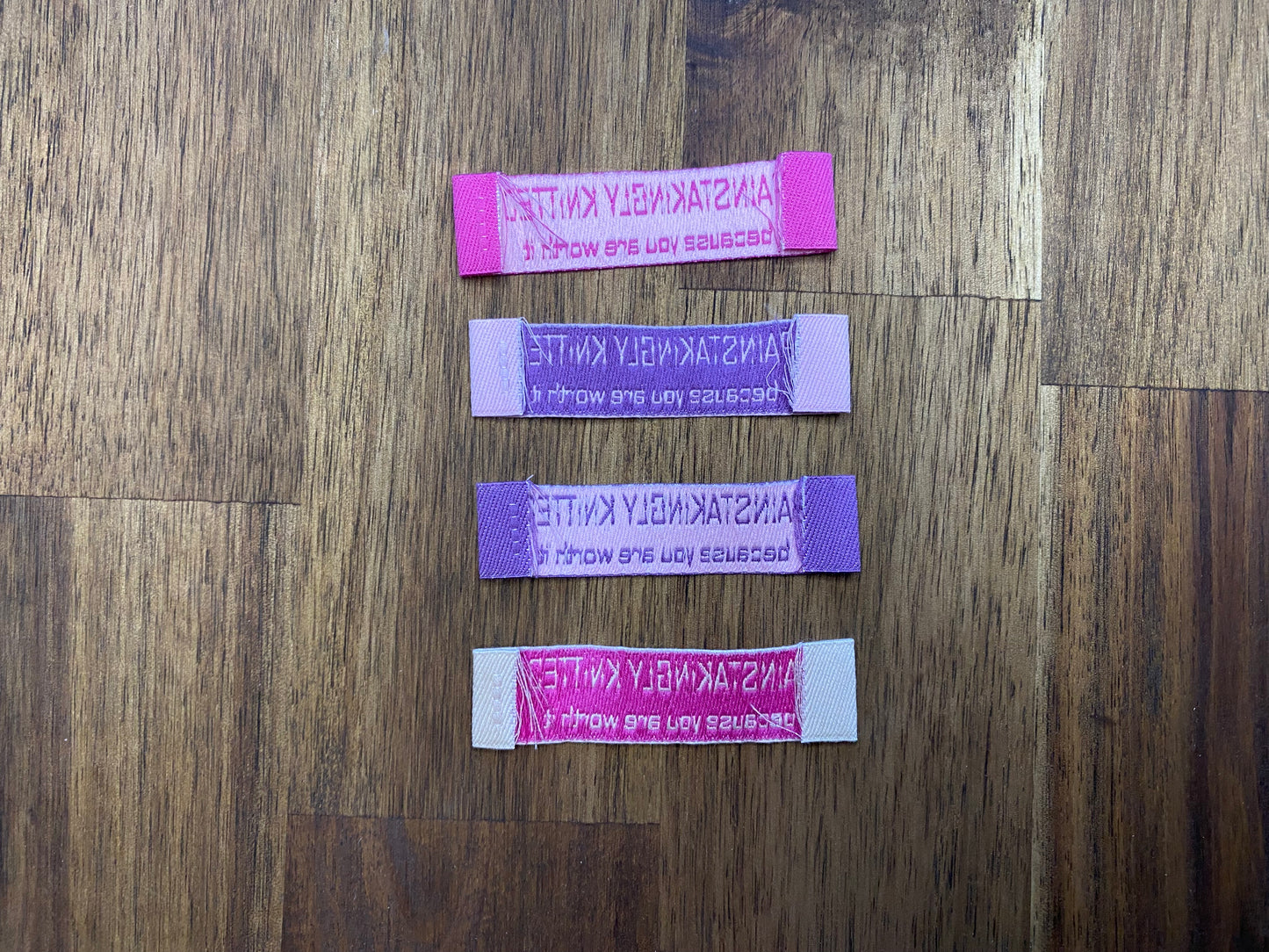 "Painstakingly knitted. Because you are worth it." - Clothing Labels for Knitted Garments - 15 mm height, 60 mm length. Cotton. Pink, purple and beige. (4 pcs / 16 pcs)