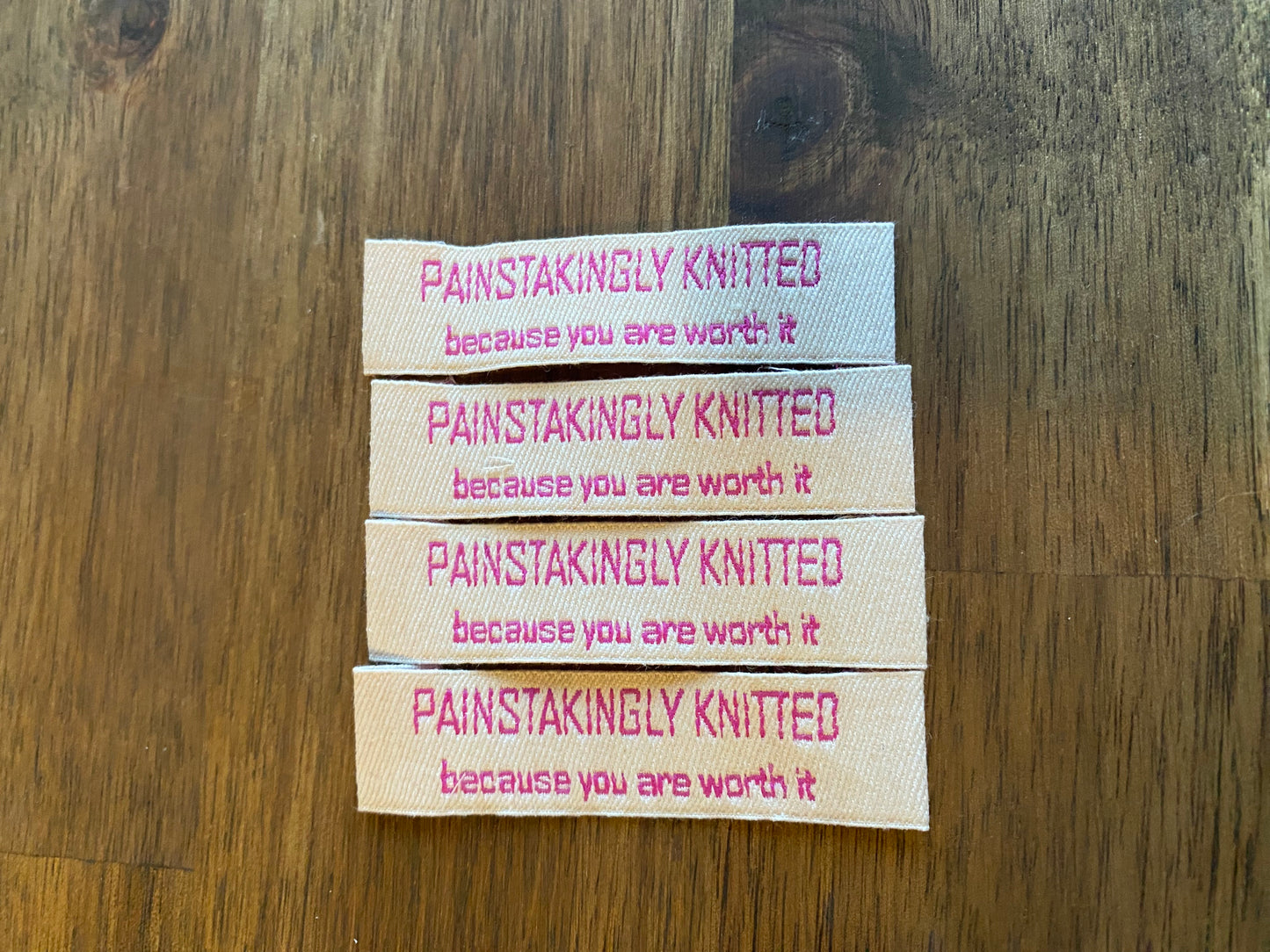 "Painstakingly knitted. Because you are worth it." - Clothing Labels for Knitted Garments - 15 mm height, 60 mm length. Cotton. Pink, purple and beige. (4 pcs / 16 pcs)