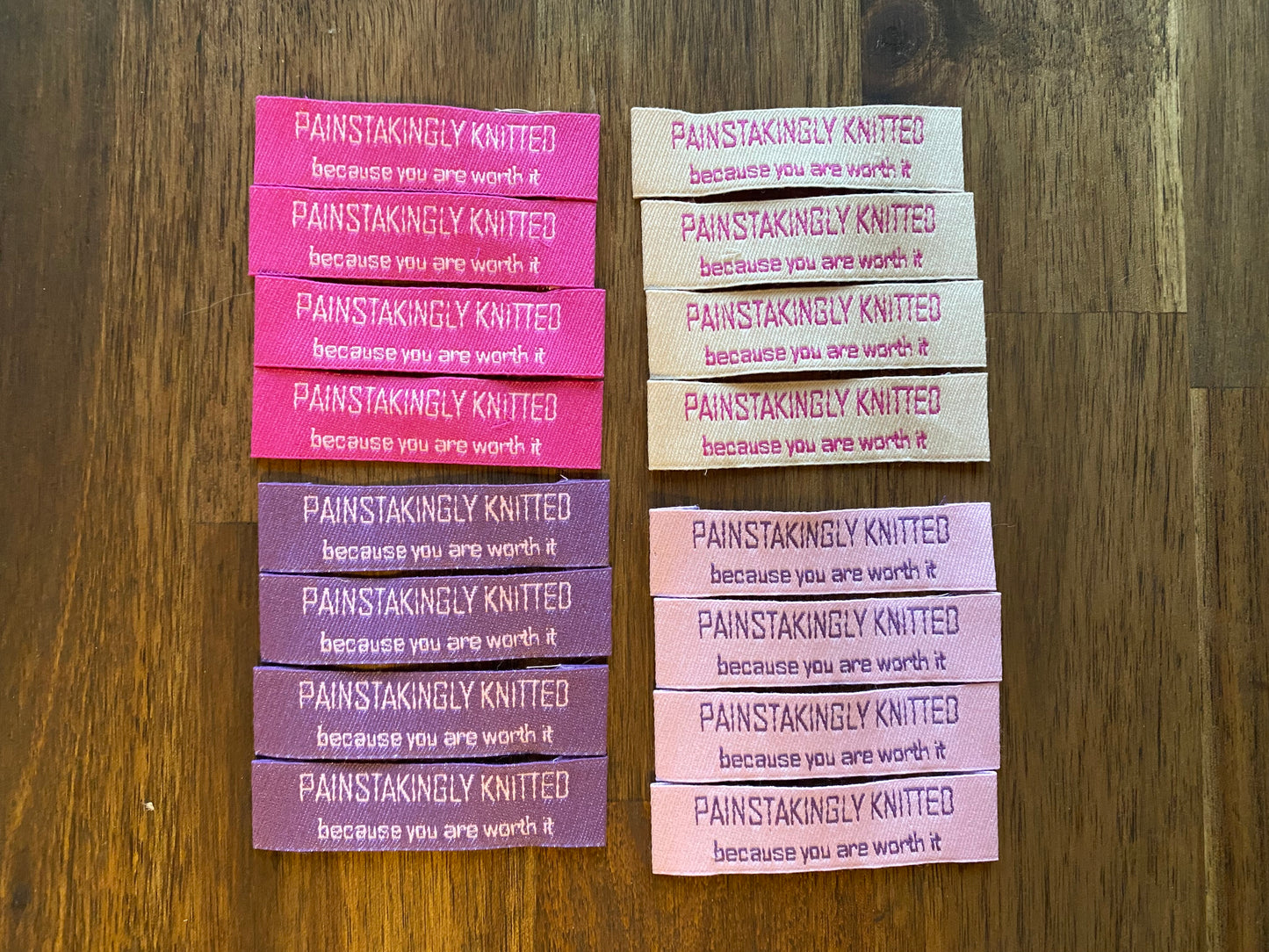 "Painstakingly knitted. Because you are worth it." - Clothing Labels for Knitted Garments - 15 mm height, 60 mm length. Cotton. Pink, purple and beige. (4 pcs / 16 pcs)