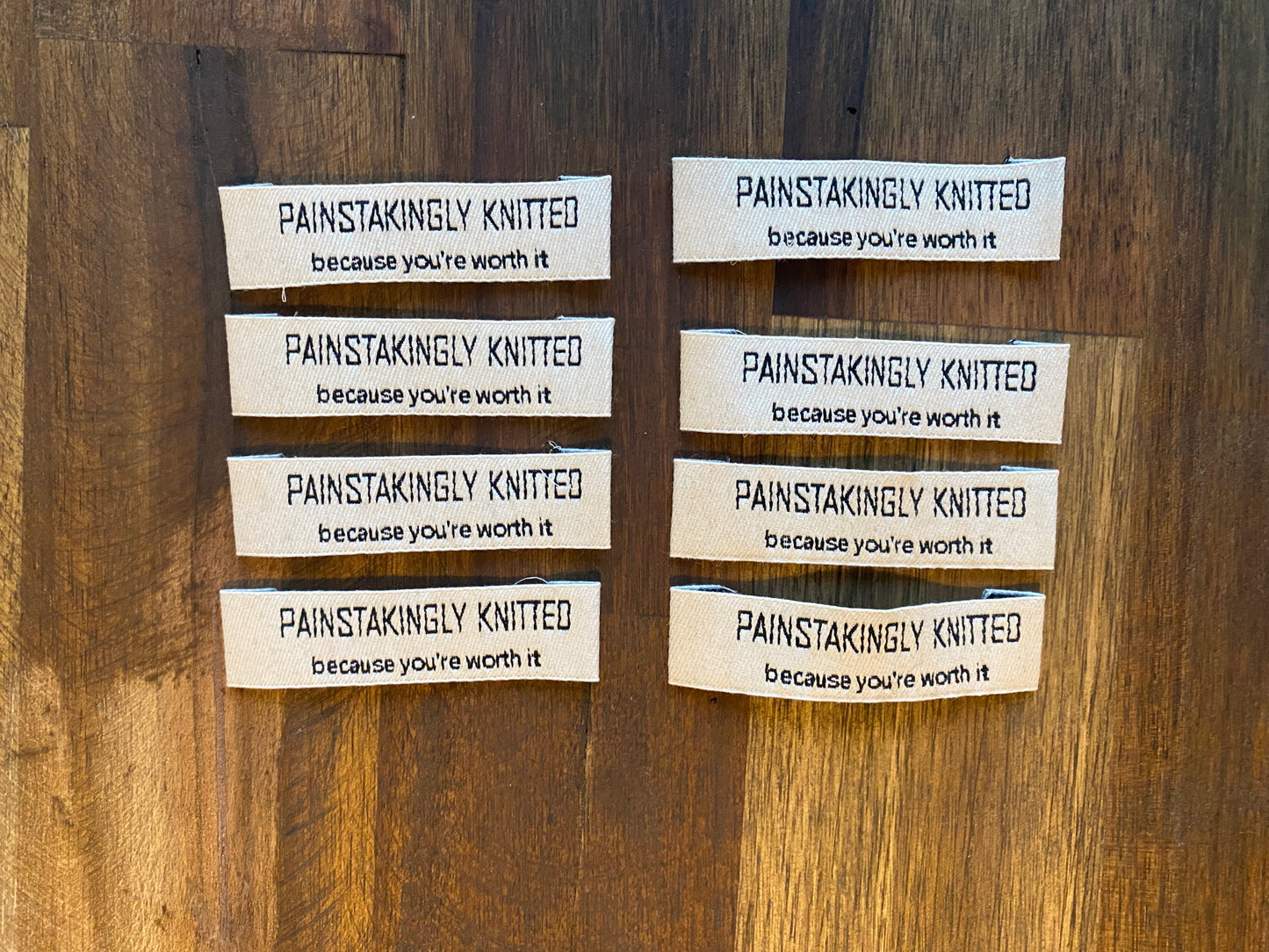 "Painstakingly knitted. Because you are worth it." - Clothing Labels for Knitted Garments - 15 mm height, 60 mm length. 8 pcs. Cotton.