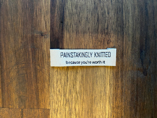 "Painstakingly knitted. Because you are worth it." - Clothing Labels for Knitted Garments - 15 mm height, 60 mm length. 8 pcs. Cotton.